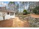 The backyard boasts a quaint stone walkway and staircase at 908 Glen Eden Dr, Raleigh, NC 27612