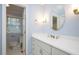 The bathroom features a vanity with drawers and a round mirror at 908 Glen Eden Dr, Raleigh, NC 27612