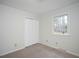 This bedroom offers a window for natural light and a closet for storage at 908 Glen Eden Dr, Raleigh, NC 27612