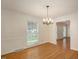 Formal dining room with hardwood floors and a chandelier at 908 Glen Eden Dr, Raleigh, NC 27612