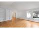 Spacious Gathering room with hardwood floors, vaulted ceiling and fireplace at 908 Glen Eden Dr, Raleigh, NC 27612