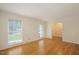 Bright living room featuring hardwood floors and large windows at 908 Glen Eden Dr, Raleigh, NC 27612
