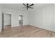 Bright bedroom with hardwood floors and ensuite bathroom access at 100 Sire Ct, Holly Springs, NC 27540