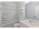 Bright bathroom features a shower and tub combination, a toilet, and a sink with white marble counter at 10310 Sablewood Dr # 108, Raleigh, NC 27617
