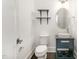 Powder room with a unique sink, vanity, and modern lighting at 10310 Sablewood Dr # 108, Raleigh, NC 27617