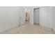 Bright bedroom features neutral carpet, white walls and closet with sliding doors at 10310 Sablewood Dr # 108, Raleigh, NC 27617