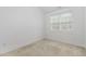 Bedroom features hardwood floors, a window with blinds and white walls at 10310 Sablewood Dr # 108, Raleigh, NC 27617