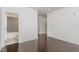 Bedroom with hardwood floors leading to an attached bathroom at 10310 Sablewood Dr # 108, Raleigh, NC 27617