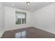 Bedroom features hardwood floors, a window with blinds and white walls at 10310 Sablewood Dr # 108, Raleigh, NC 27617