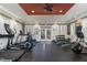 Well-equipped fitness center with treadmills, elliptical machines, weights and ceiling fan at 10310 Sablewood Dr # 108, Raleigh, NC 27617
