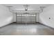 A spacious and clean two car garage with white walls and a concrete floor at 10310 Sablewood Dr # 108, Raleigh, NC 27617