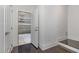 Hallway with stairs leading to the garage at 10310 Sablewood Dr # 108, Raleigh, NC 27617