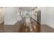 Open concept kitchen with island, stainless steel appliances, and hardwood floors at 10310 Sablewood Dr # 108, Raleigh, NC 27617
