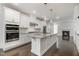Gourmet kitchen boasts granite countertops, island, and stainless steel appliances at 10310 Sablewood Dr # 108, Raleigh, NC 27617