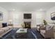 Bright living room features a fireplace, TV, and stylish decor at 10310 Sablewood Dr # 108, Raleigh, NC 27617