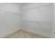 Walk-in closet with built-in wire shelving for efficient storage and organization at 10310 Sablewood Dr # 108, Raleigh, NC 27617