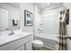 Clean bathroom with a shower/tub combo and neutral decor at 104 Cavalier Rider Run, Wendell, NC 27591