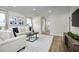 Spacious living area with light walls, neutral furniture and hardwood floors at 104 Cavalier Rider Run, Wendell, NC 27591