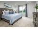 Spacious main bedroom with neutral decor and large window at 104 Cavalier Rider Run, Wendell, NC 27591