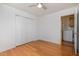 Bedroom with hardwood floors, double closets, and access to laundry at 107 Cedar Ct, Oxford, NC 27565