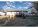 Rear view of house, deck, and carport at 107 Cedar Ct, Oxford, NC 27565