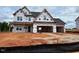 New two-story home under construction with a two-car garage at 110 Tennyson Dr, Garner, NC 27529