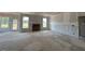 Expansive living area boasts a cozy fireplace and is bathed in natural light, awaiting personal touches at 110 Tennyson Dr, Garner, NC 27529