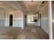 Open-concept living space showcasing abundant natural light, a fireplace, and seamless transitions between rooms at 110 Tennyson Dr, Garner, NC 27529