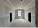 Bright room featuring a window and built-in alcoves at 110 Tennyson Dr, Garner, NC 27529