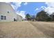 View of homes and grassy backyard area at 111 Rivercamp St, Clayton, NC 27527