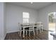 Bright dining room with table and chairs near sliding door at 111 Rivercamp St, Clayton, NC 27527