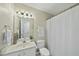 Simple bathroom with a toilet, sink, and shower at 1112 Silky Dogwood Trl, Apex, NC 27502