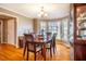 Formal dining room with hardwood floors and a china cabinet at 1302 Apache Ln, Apex, NC 27502