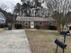 Brick ranch house with a spacious yard and driveway at 1304 Tralea Dr, Durham, NC 27707