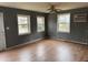 Living room featuring hardwood floors and multiple windows at 1304 Tralea Dr, Durham, NC 27707