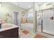 Main bathroom with double vanities, soaking tub and walk-in shower at 139 Red Angus Dr, Smithfield, NC 27577