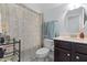 Clean bathroom with shower/tub, vanity, and patterned curtain at 139 Red Angus Dr, Smithfield, NC 27577