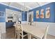 Dining room with hardwood floors and view into living room with fireplace at 139 Red Angus Dr, Smithfield, NC 27577