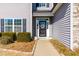 Front door with glass panels and landscaping at 139 Red Angus Dr, Smithfield, NC 27577