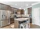Updated kitchen featuring stainless steel appliances and dark wood cabinets at 139 Red Angus Dr, Smithfield, NC 27577