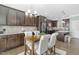 Eat-in kitchen with dark cabinetry, granite counters, and stainless steel appliances at 139 Red Angus Dr, Smithfield, NC 27577
