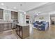 Open floor plan showcasing kitchen island and living room with sectional sofa at 139 Red Angus Dr, Smithfield, NC 27577