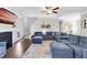 Bright living room showcasing a sectional sofa, fireplace, and hardwood floors at 139 Red Angus Dr, Smithfield, NC 27577