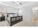 Spacious main bedroom with plush carpeting, a large bed and ensuite bathroom at 139 Red Angus Dr, Smithfield, NC 27577