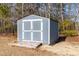 Gray storage shed with double doors at 139 Red Angus Dr, Smithfield, NC 27577