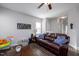 Living room with hardwood floors, leather sofas, and a TV at 1403 Pineview Dr, Garner, NC 27529