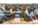 Aerial view of a two-story house with a gray roof and white siding, nestled in a residential neighborhood at 1416 Weavers Trace Dr, Zebulon, NC 27597