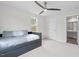 Bedroom with grey daybed, ceiling fan, and neutral decor at 1514 Excelsior Grand Ave, Durham, NC 27713