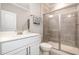 Clean bathroom with a shower, toilet and white vanity at 1518 Cloverfield Ct, Wake Forest, NC 27587