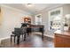 Elegant music room showcasing a grand piano and hardwood floors at 1518 Cloverfield Ct, Wake Forest, NC 27587